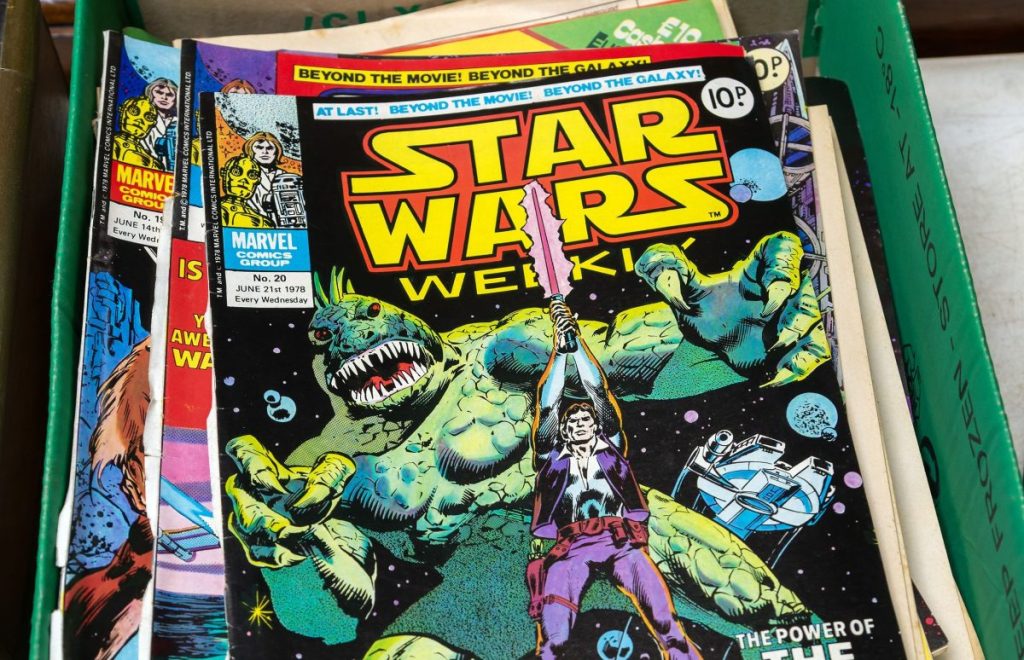 Box of Star Wars Weekly comics on display in auction room, UK.