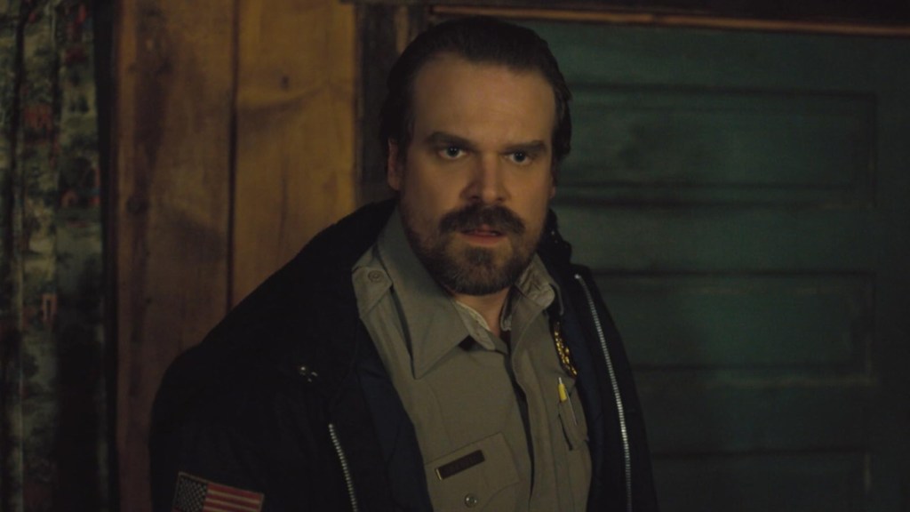 David Harbour stands as Hopper in Stranger Things.